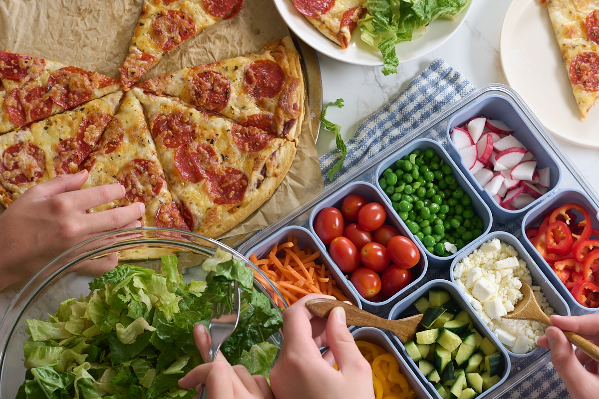 salad and pizza family dinner