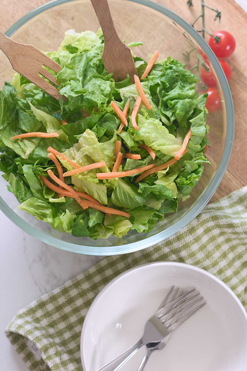 salad with bowls and forks, overhead