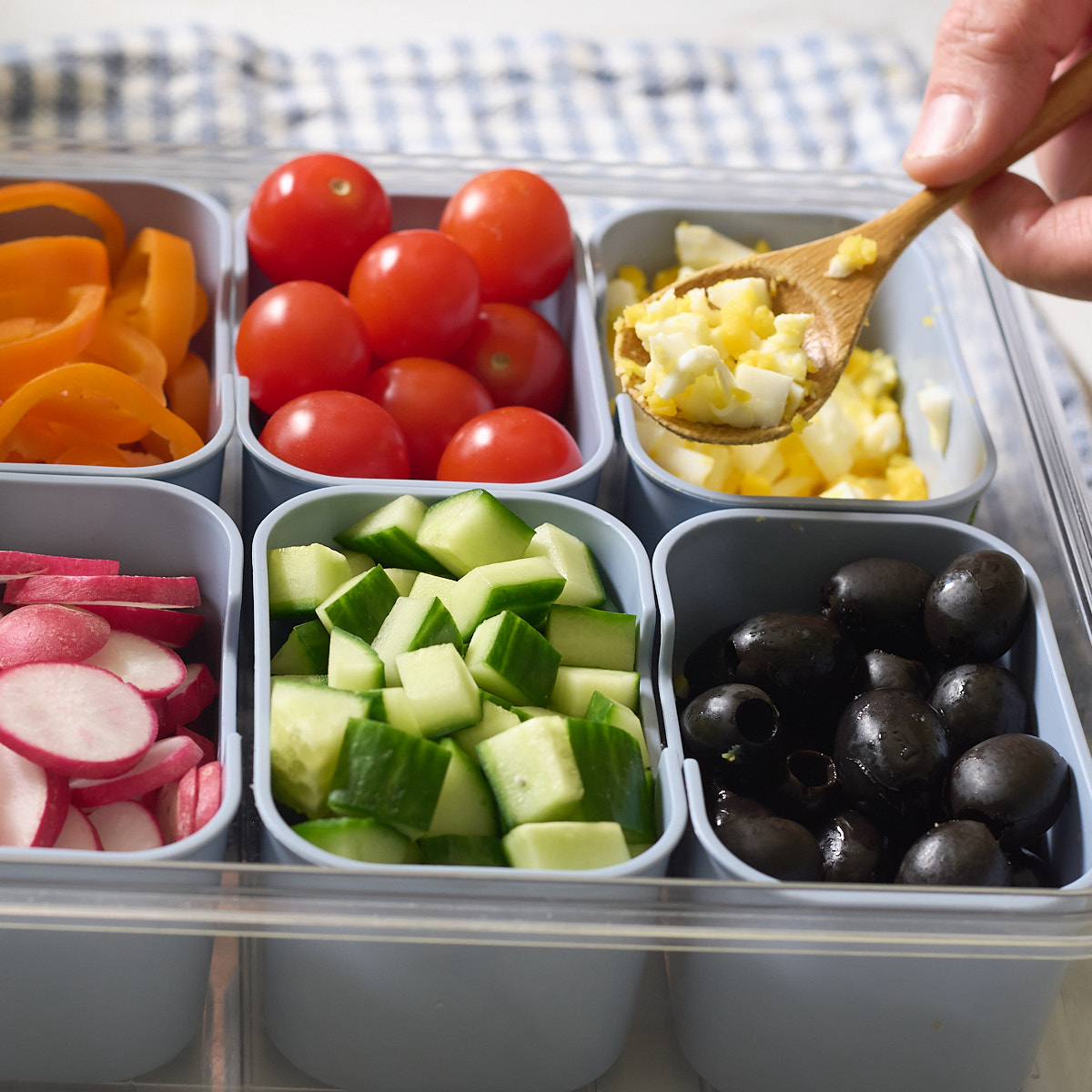 adding boiled egg to salad bar
