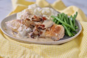 chicken dijon on plate with bacon