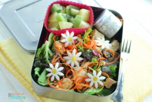 chicken salad bento with poppy seed dressing - the daisies are made with radish, carrots, and a little flower cookie cutter!