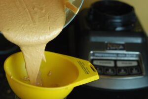 Coconut Cashew Butter, pouring into a jar