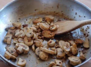 browning the mushrooms, garlic, and shallots in the sausage drippings - if you could only smell how good this is!