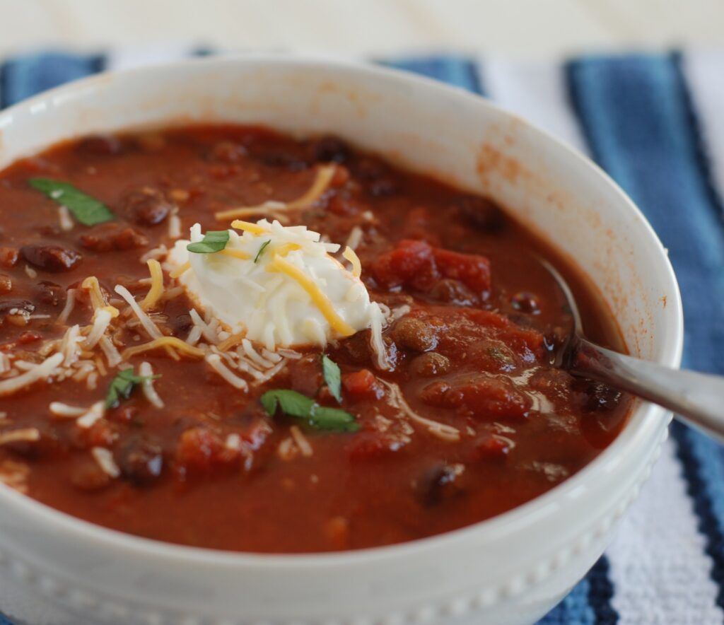 Slow Cooker Meatless Chili is the perfect meal to come home to on a cold winter night., and it's cheap to make!