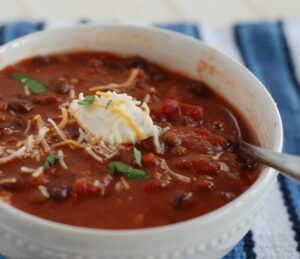 Slow Cooker Meatless Chili is the perfect meal to come home to on a cold winter night., and it's cheap to make!