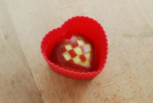 this is a picture of a red apple cut into a heart shape. Read more a t beneficial-bento.com