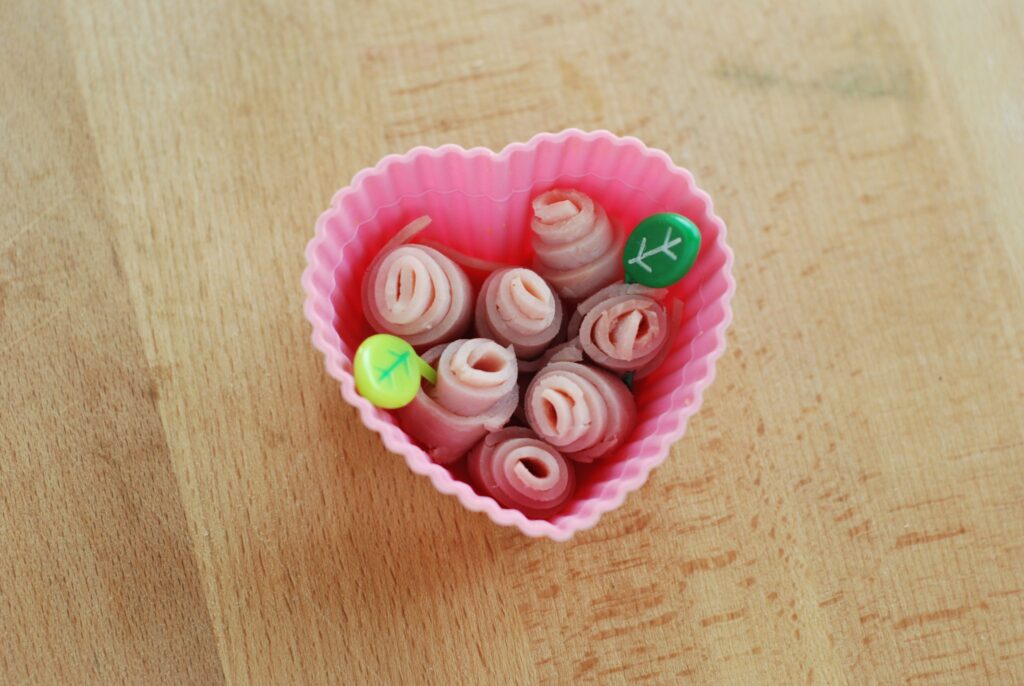 This is a picture of ham rolled into rosette shapes. Read more at beneficial-bento.com