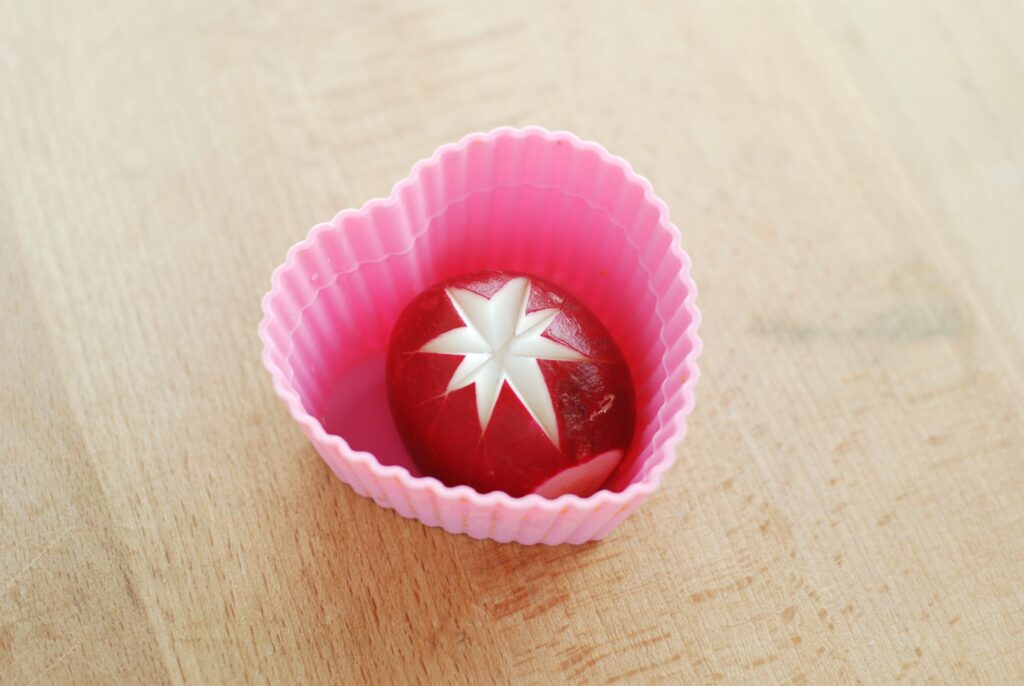 this is a picture of a radish with a star shape cut into it. Read more at beneficial-bento.com.
