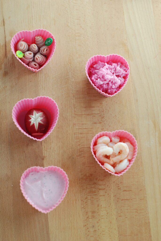 This is a picture of natural pink foods in silicone cups. Read more at beneficial-bento.com