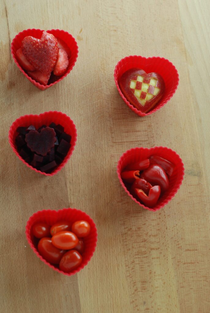 This is a picture of natural red food in red silicone cups. Read more at beneficial-bento.com