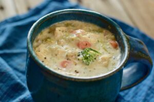 This is an image of Low Carb Chicken and Wild Rice soup in a mug