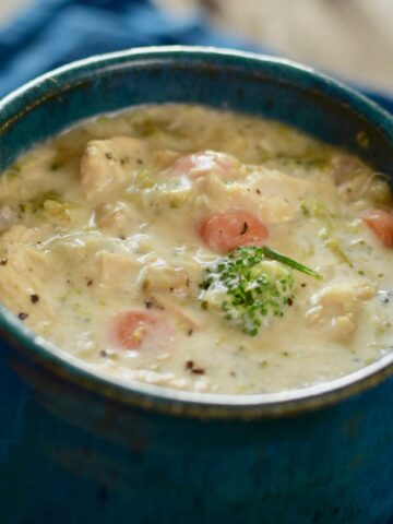 This is an image of Low Carb Chicken and Wild Rice soup in a mug