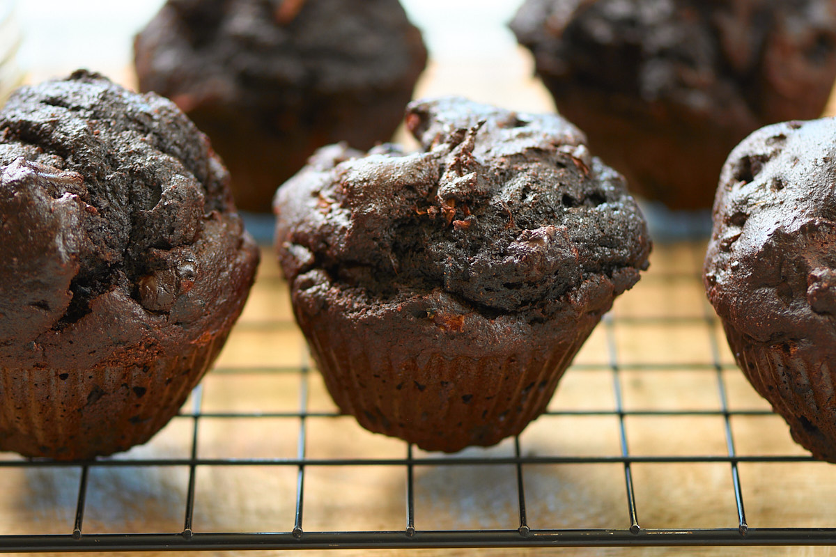 chocolate zucchini muffins on rack