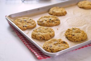 pumpkin chocolate chip cookies on baking shet