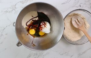 step 2. Mix oil, eggs, sugar, molasses, flax