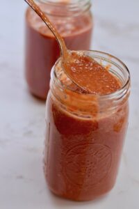 enchilada sauce with spoon