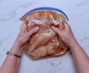 step 4. squeeze bag to coat chicken