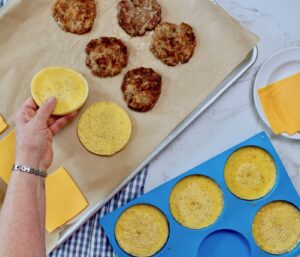 put egg and sausage on baking sheet