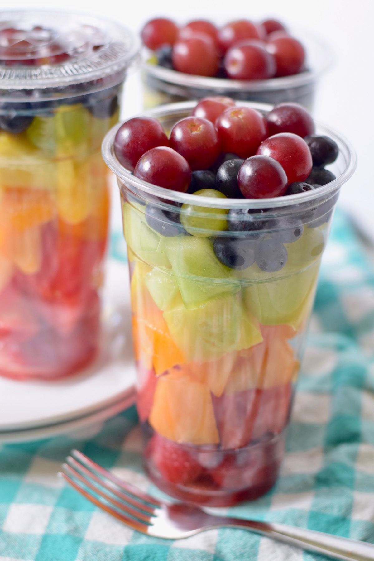 rainbow fruit salad in clear cup