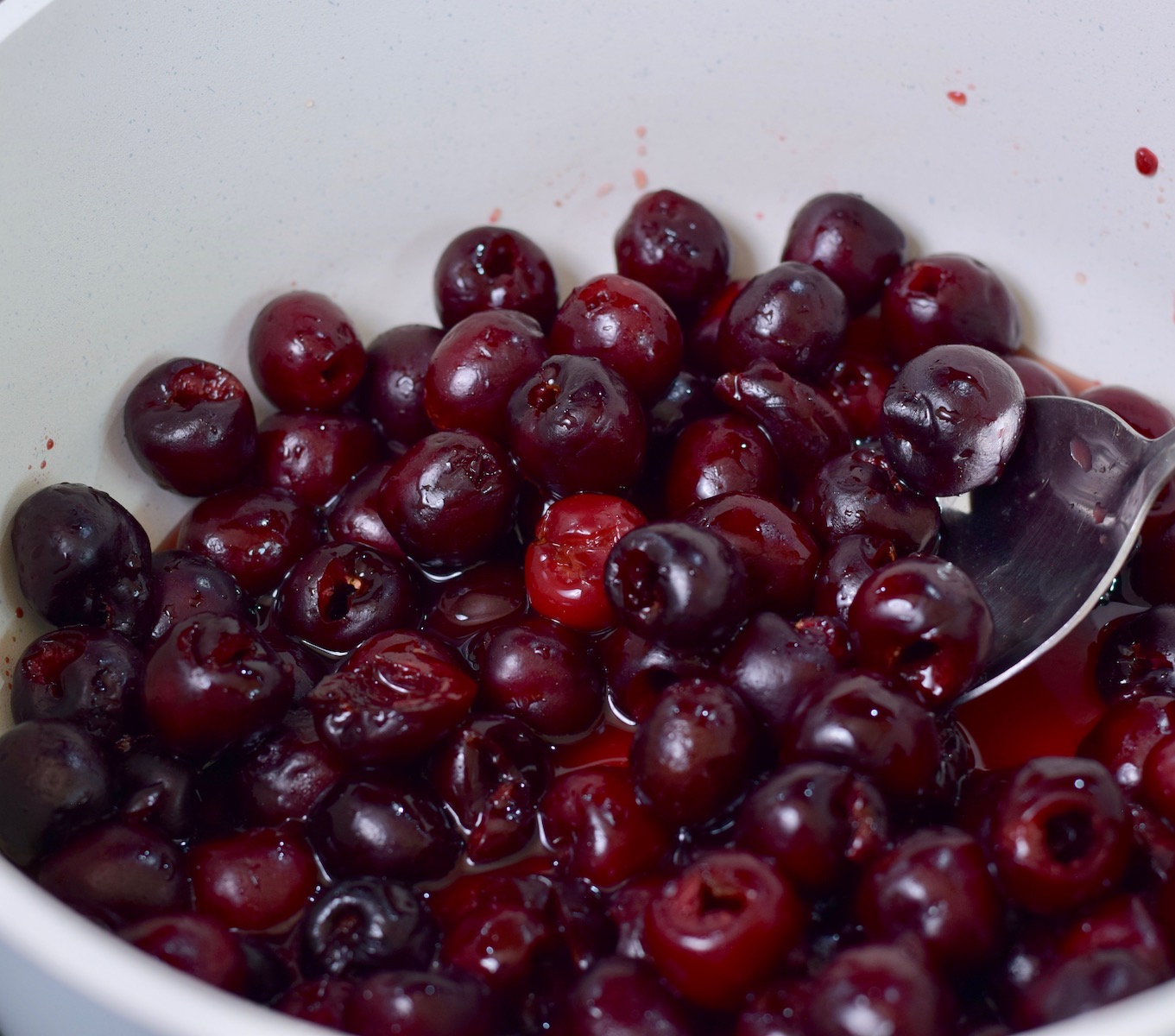 step 2. add cherries juice and lemon to pan