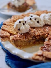 pecan pie with whipped cream and chocolate chips