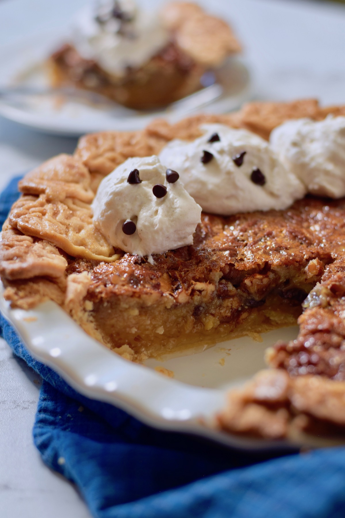 pecan pie with whipped cream and chocolate chips