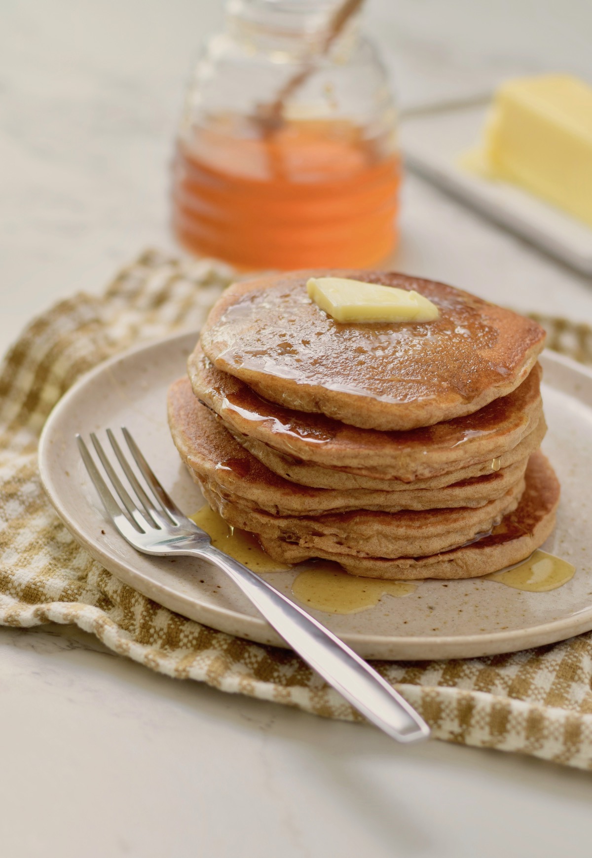 gluten free honey oat pancakes with fork