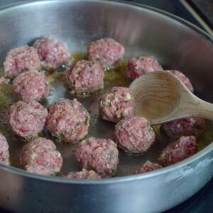 step 5. add meatballs to skillet