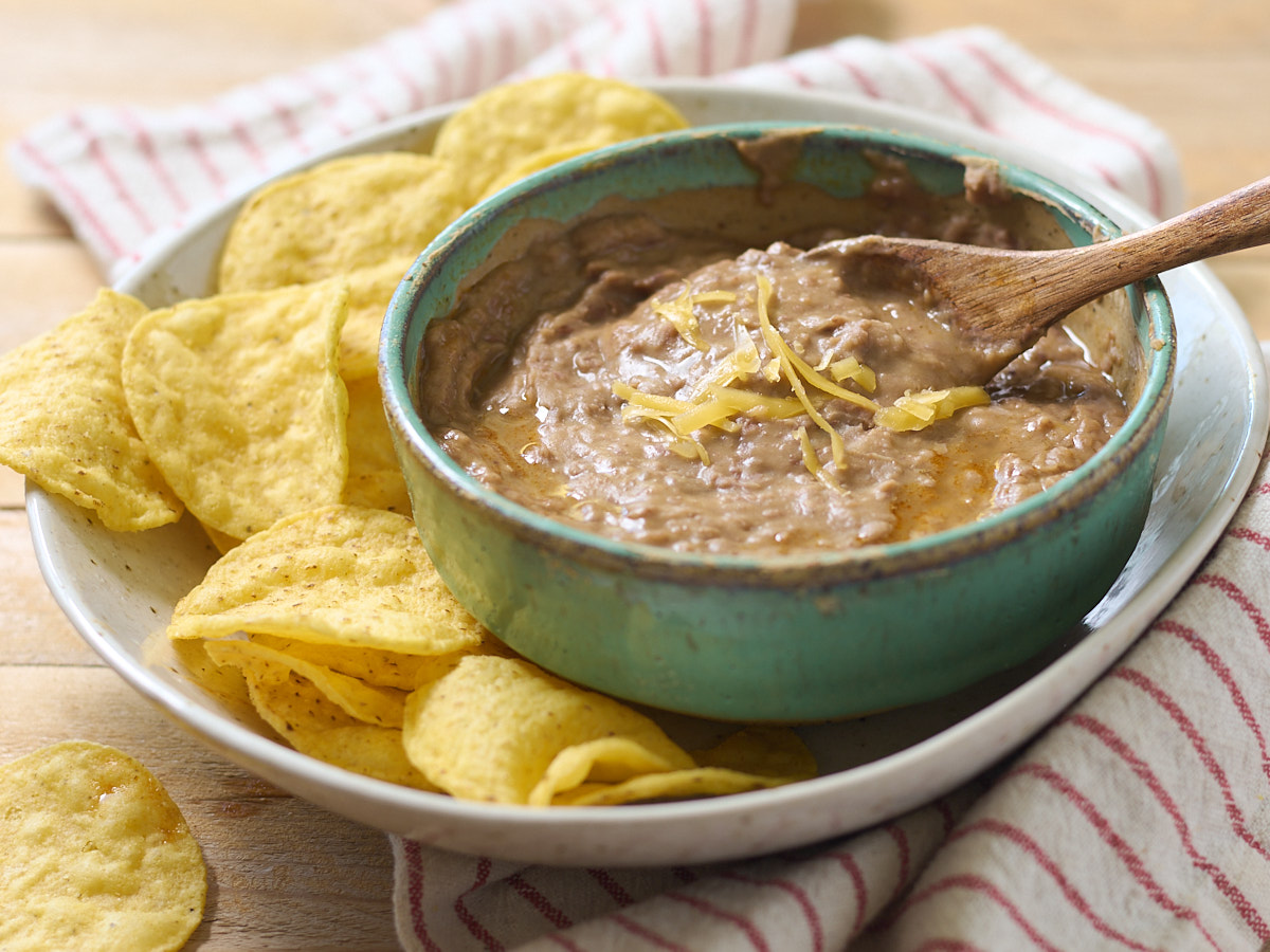 refried beans in bowl with chips