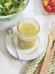 garlic and herb vinaigrette in jar with whisk