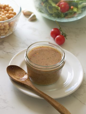 dressing in jar with spoon