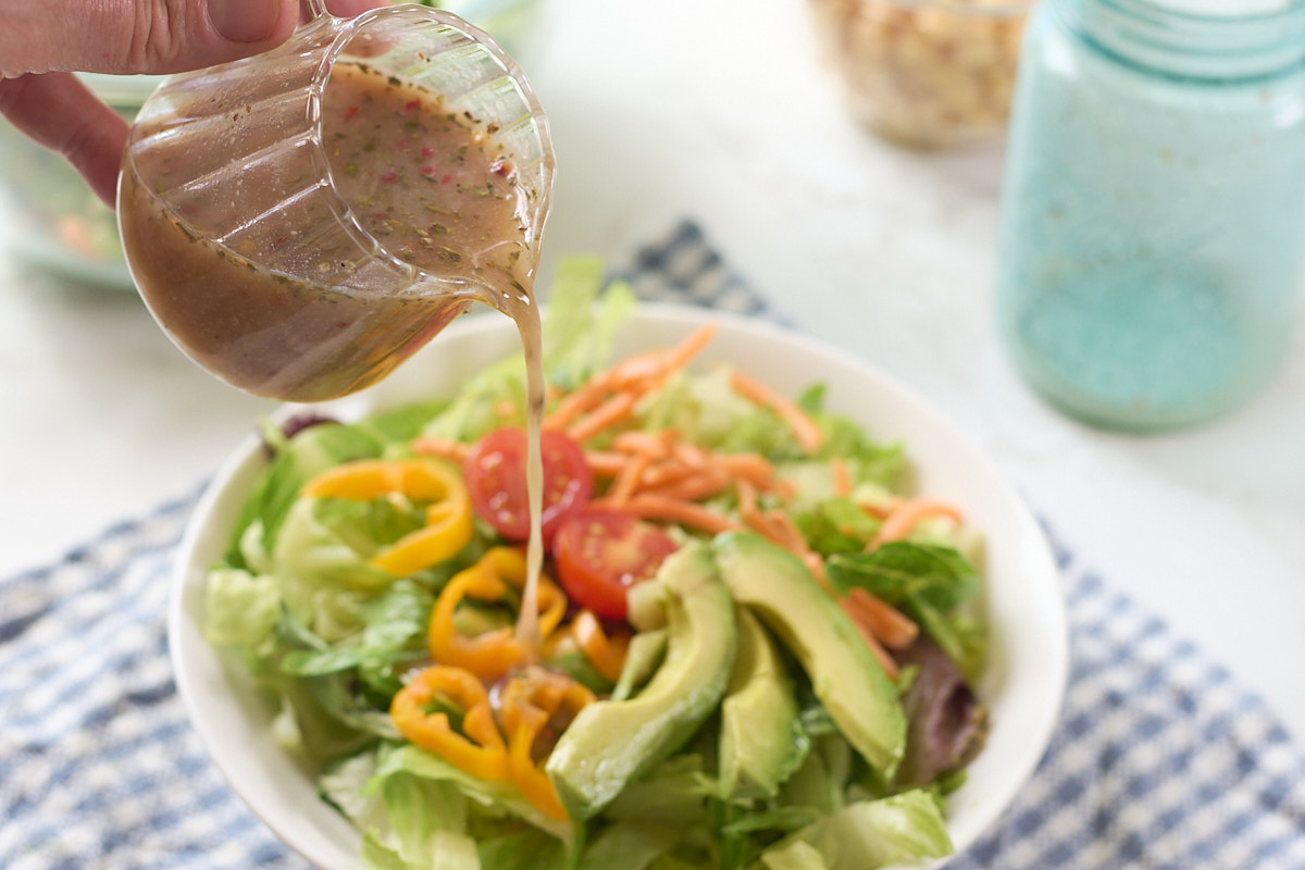 aquafaba dressing poured on salad