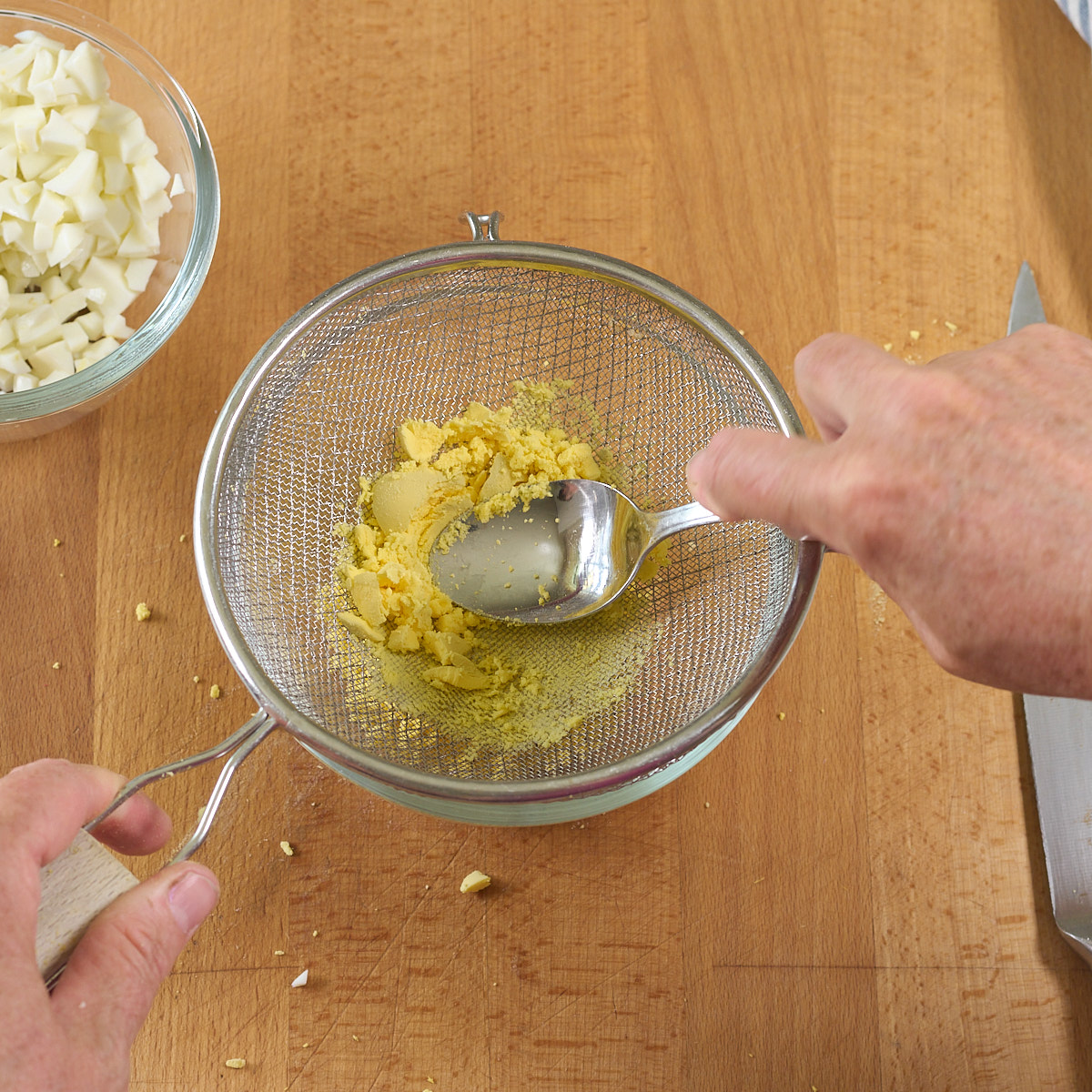 step 4. press yolks through sieve
