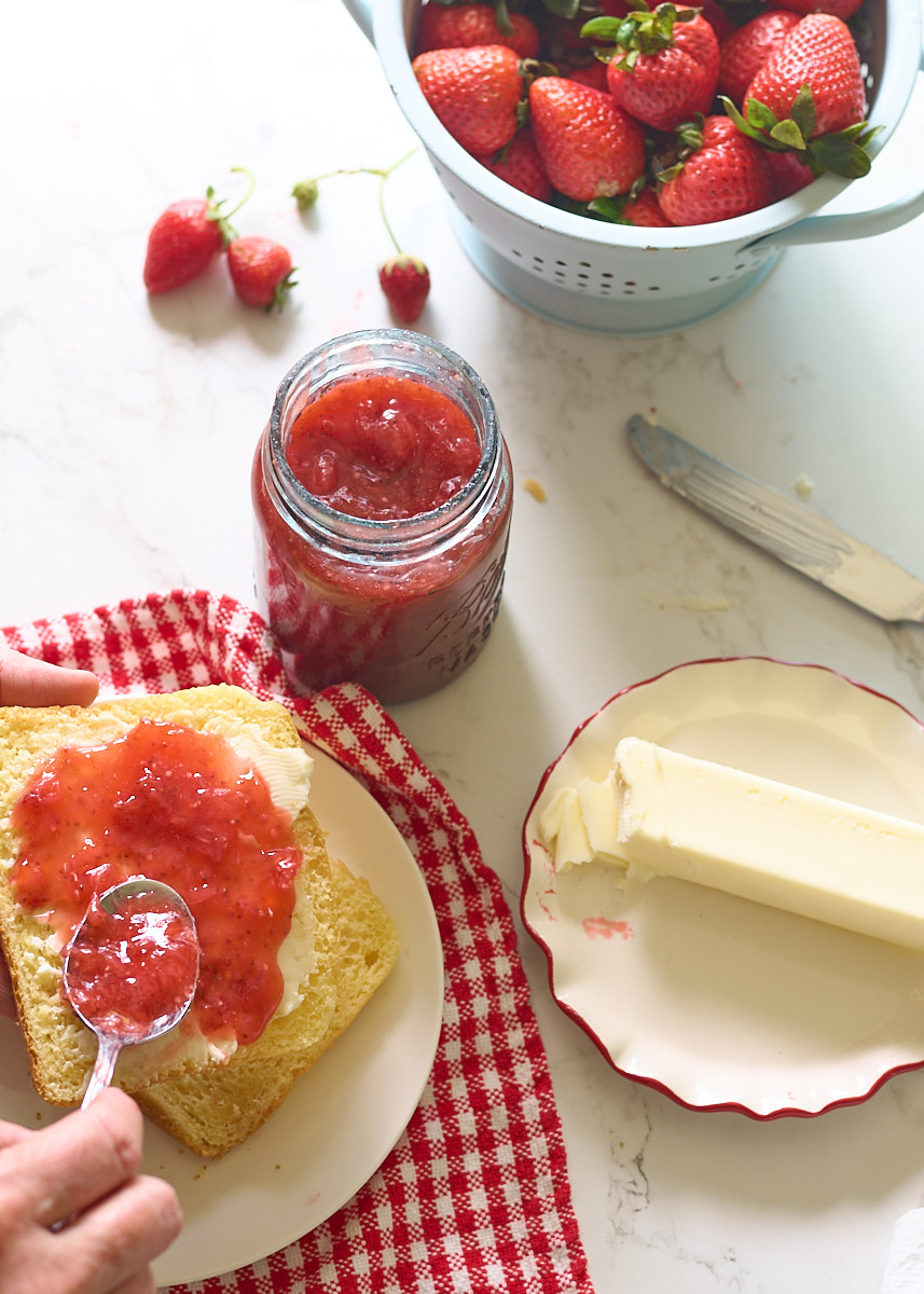 spreading jam on bread