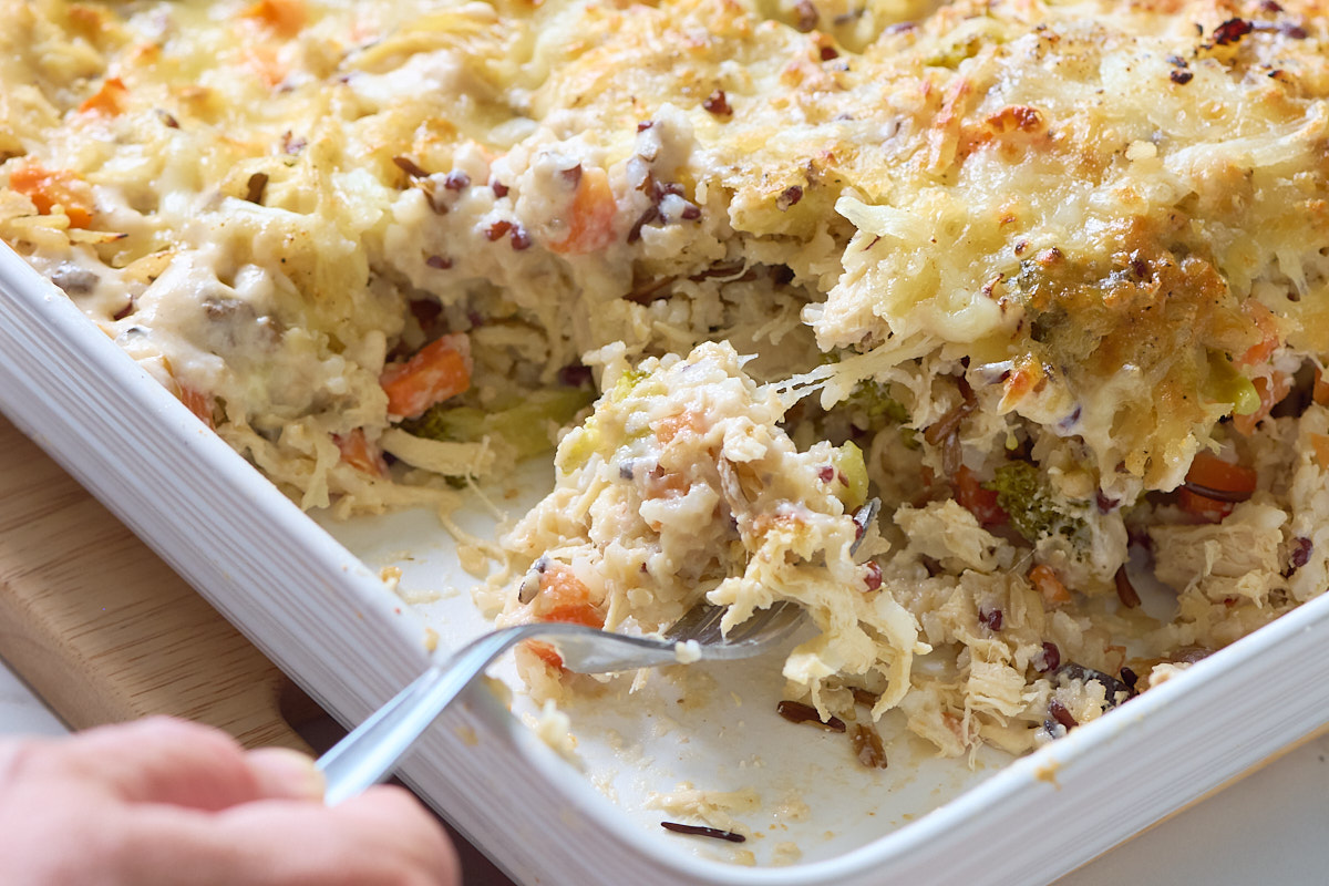 chicken and wild rice casserole in dish with spoon